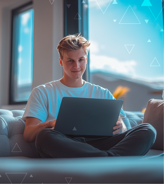 Person sitting on a couch with their laptop